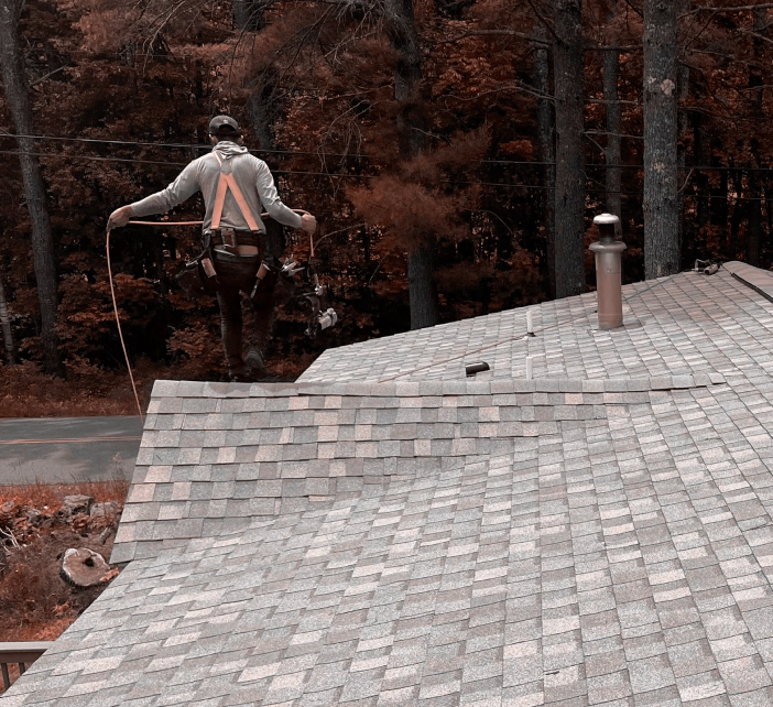 worker installing roof