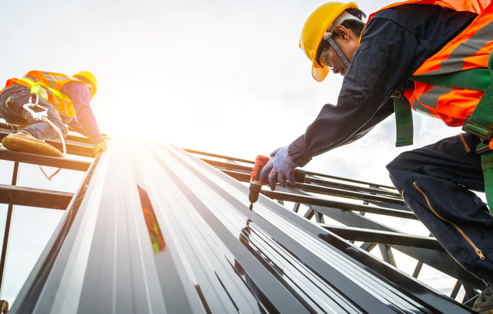 workers doing metal roofing installation